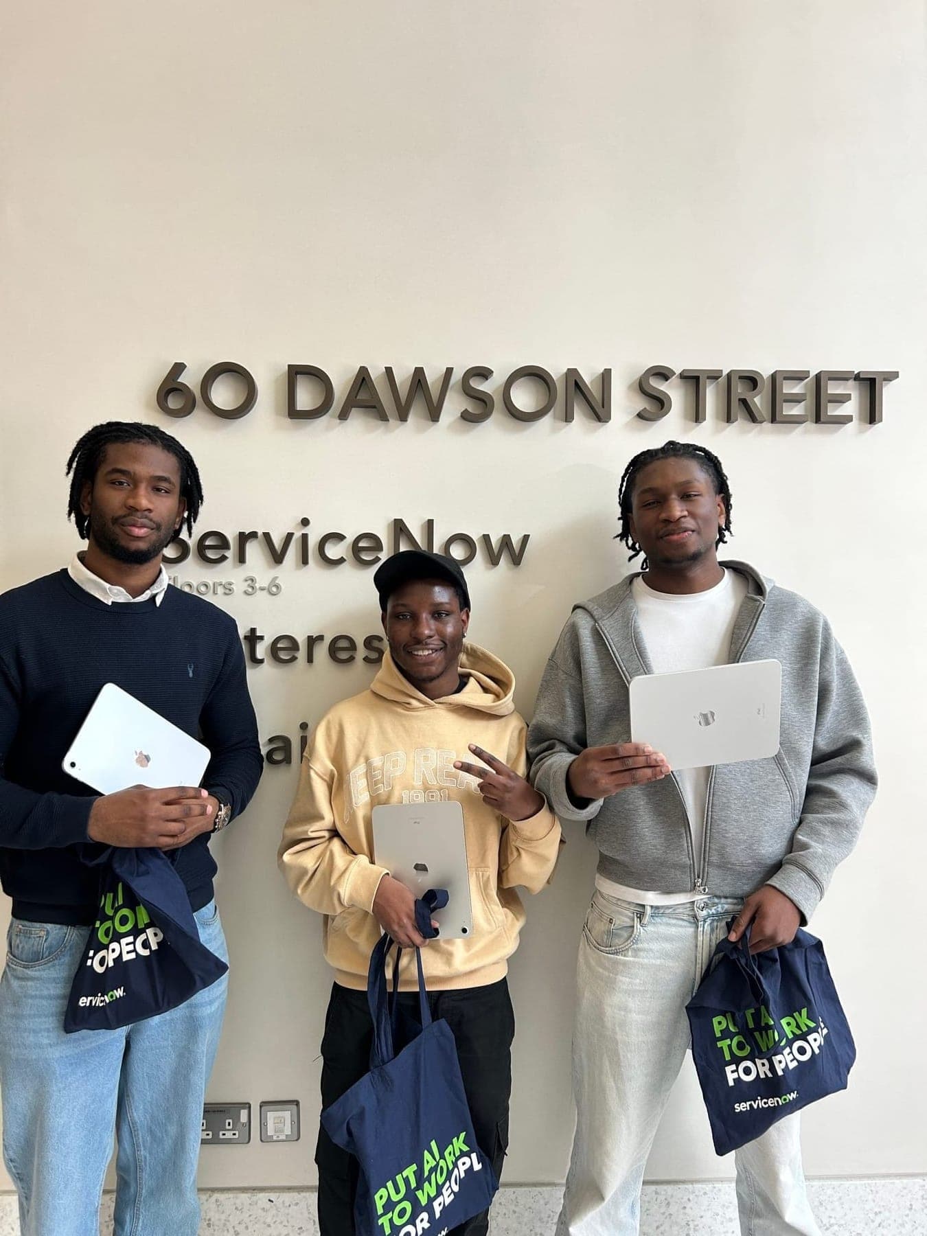 The CareFlow AI team holding their prizes at the ServiceNow office on Dawson Street, Dublin.